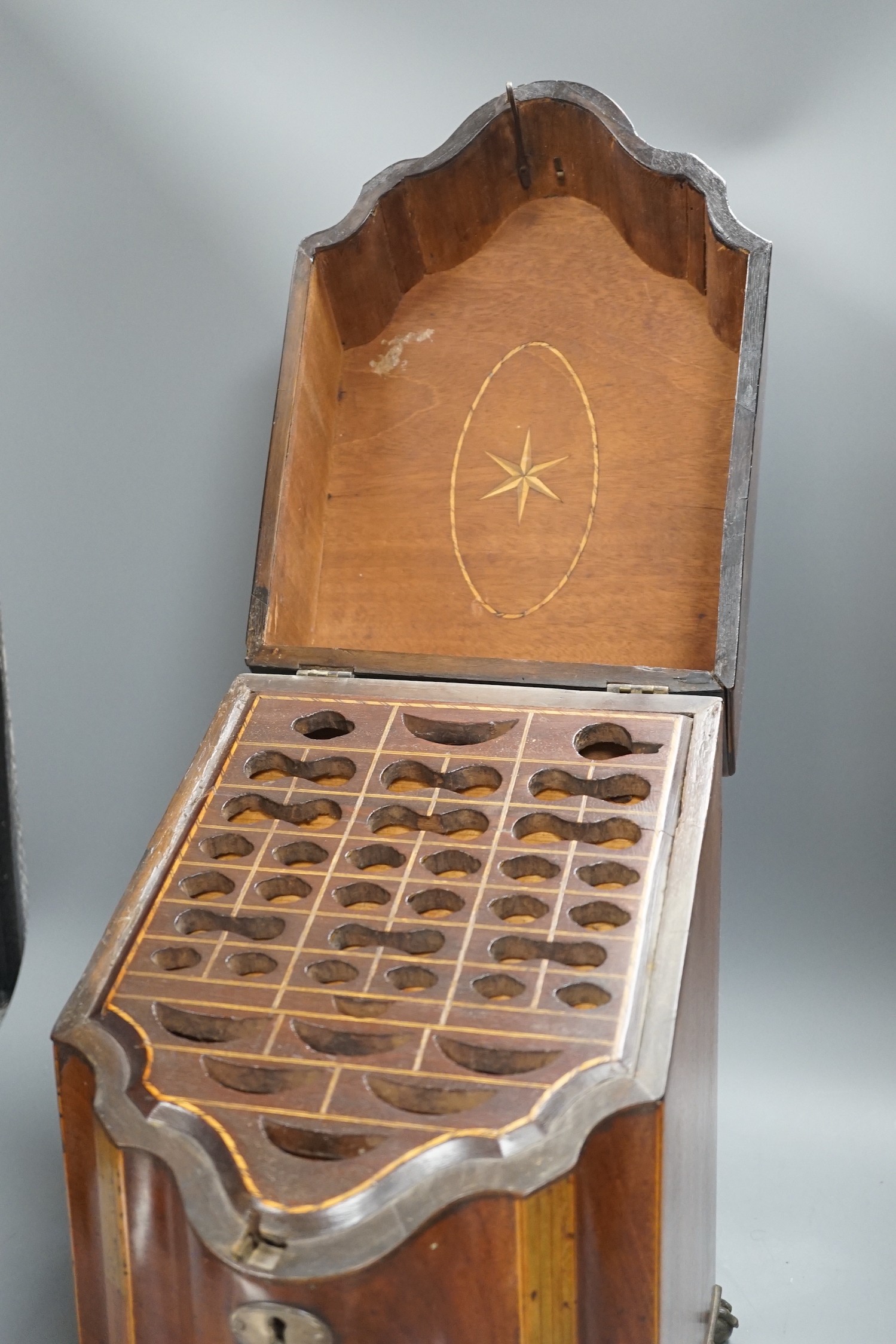 A George III mahogany knife box, with ball and claw feet, 38cms high